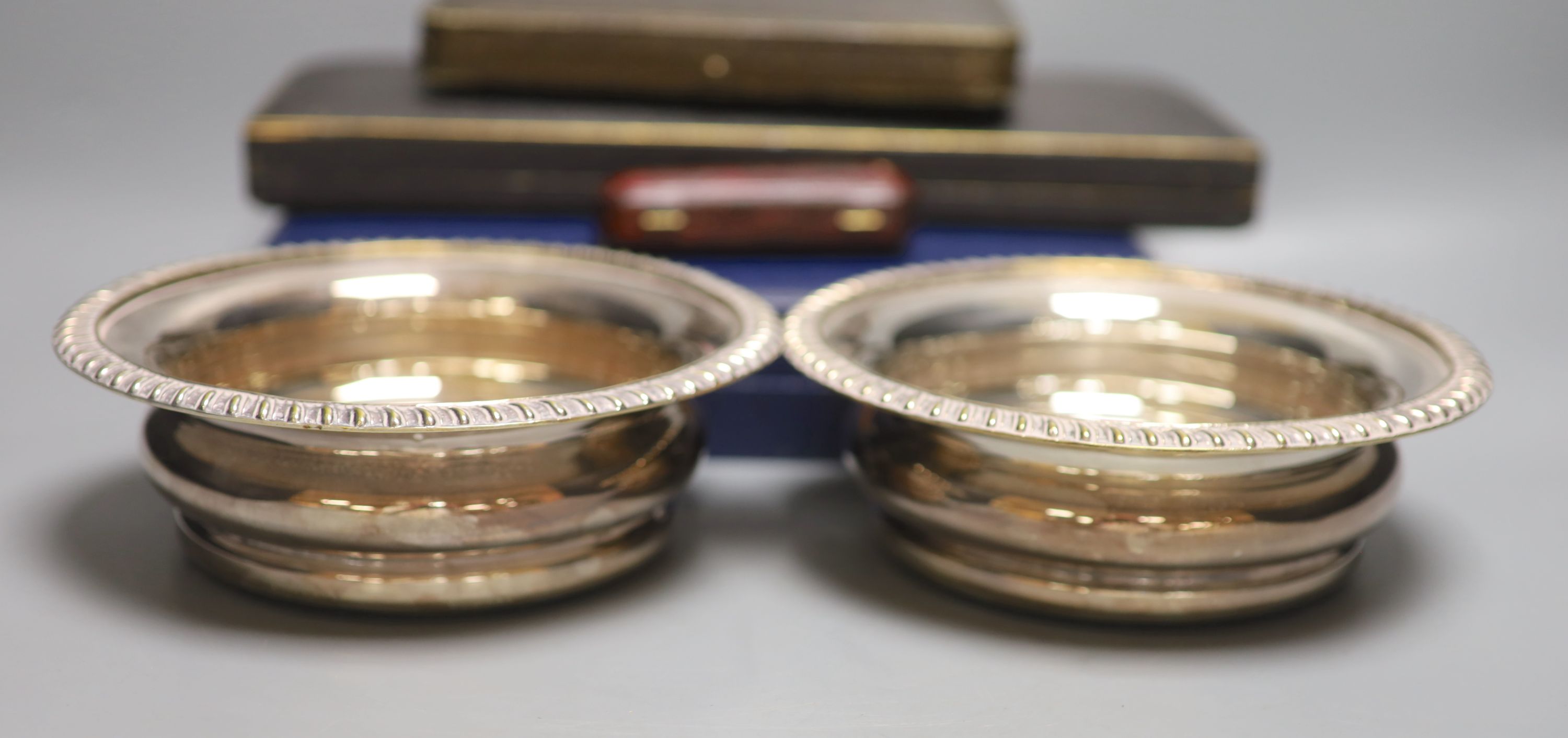 A silver-mounted amber cheroot holder, cased, with Russian inscription, Birmingham 1896 and sundry silver and plated flatware,